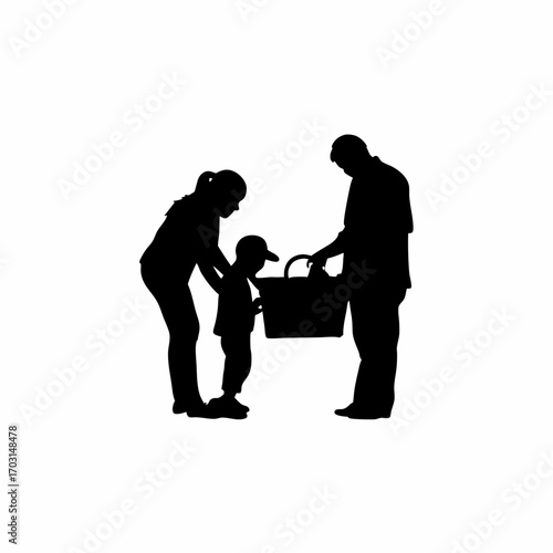 Family silhouette preparing picnic basket for outdoor meal