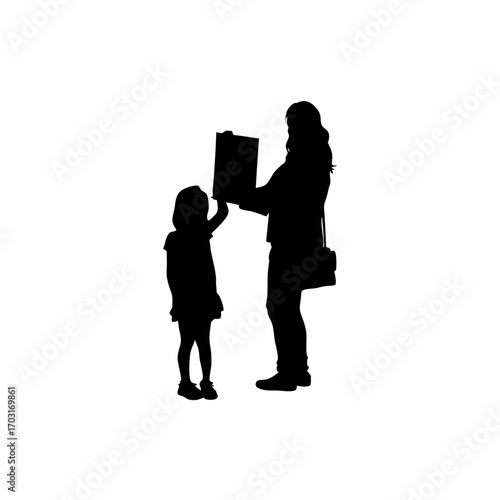 Silhouette of a little girl showing her drawing to her mother