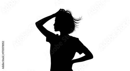 Silhouette of woman styling her hair in a moment of introspection