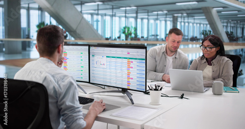 Fotomural Team Using Spreadsheet Software For Billing Report Analysis