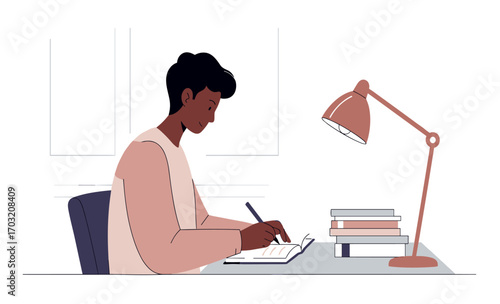 A young African American man sits at a desk diligently writing in a notebook, illuminated by a desk lamp, books stacked nearby, suggesting study or creative work.