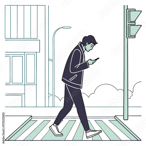 Young man distracted by his smartphone while walking on a crosswalk.