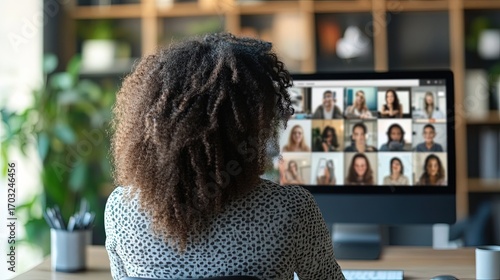 Professional woman attending an online conference via video call.