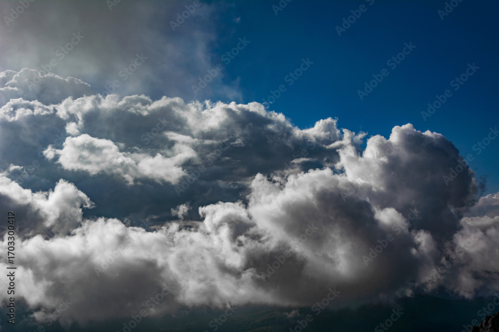 custom made wallpaper toronto digitalMassive white clouds rising against a bright blue sky creating a dramatic and atmospheric high-altitude weather scene