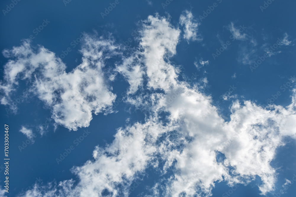 custom made wallpaper toronto digitalWhite clouds scattered around a vivid blue sky forming a circular opening that creates a dynamic and atmospheric scene