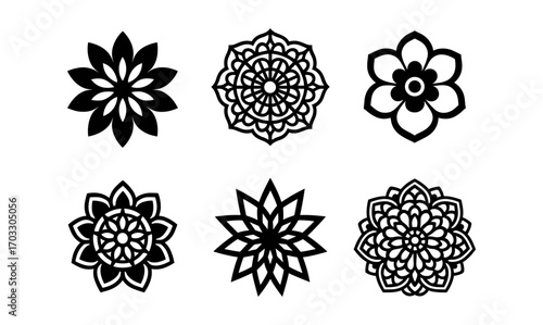 Ornamental floral designs: intricate mandala patterns in black silhouette style