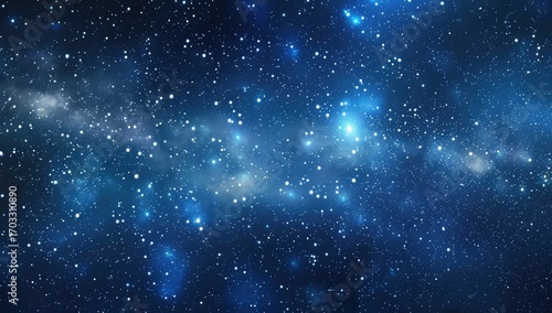 A deep blue cosmic scene filled with countless stars of varying brightness, clustered in nebulae and scattered across a vast expanse of space