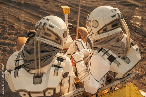 A rear view of two astronauts with visible helmets exploring the surface of an alien planet.