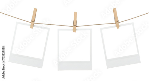 Blank Instant Photo Frames on Twine Clothesline with Clothespins. Polaroid PNG. Clipping path.