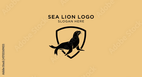 Elegant black sea lion logo design within a protective shield, ideal for branding.