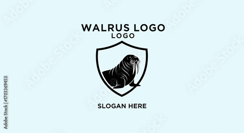 A black silhouette of a walrus is depicted within a shield emblem, accompanied by the text "WALRUS LOGO" and "SLOGAN HERE" on a light blue background.