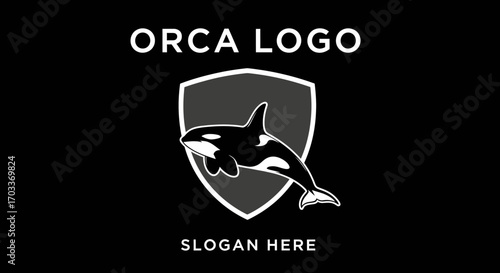 A stylized black and white logo featuring an orca whale swimming within a shield emblem, with "ORCA LOGO" and "SLOGAN HERE" text.