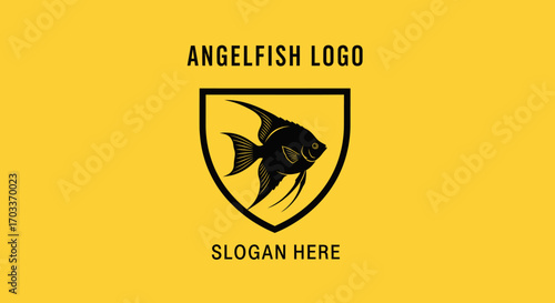 A striking black angelfish silhouette is centrally displayed within a dark shield emblem on a vibrant yellow background, with "ANGELFISH LOGO" above and "SLOGAN HERE" below.