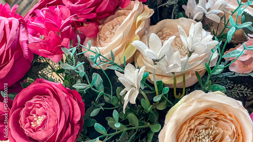 Obraz na plátně Artificial Pink And Cream Roses And Mixed Fabric Flowers With Green Leaves, Idea