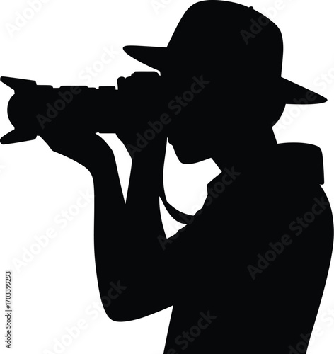 Person wearing hat taking photograph silhouette camera