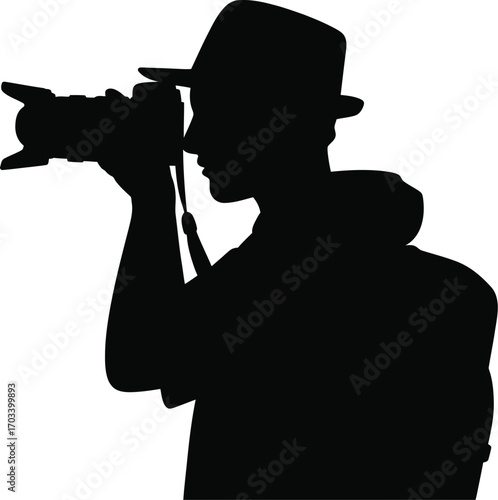Person wearing hat holding camera silhouette male