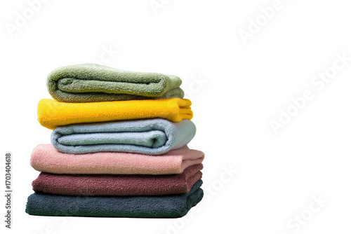 Stack of folded blankets in various colors