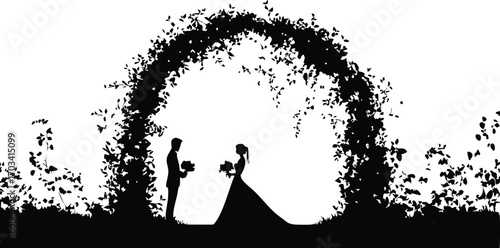 Silhouette of a bride and groom standing under a floral archway on their wedding day