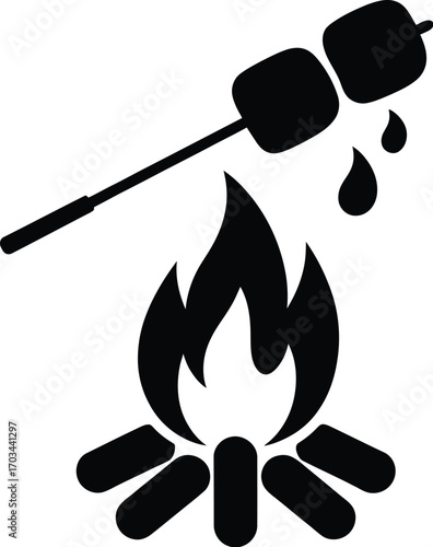 Marshmallows roasting over campfire skewer