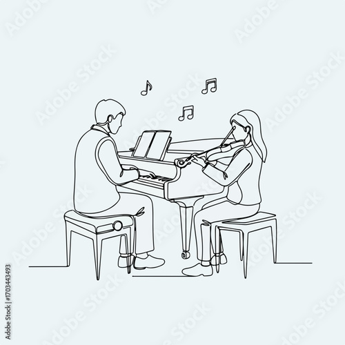 Music lesson with piano and violin. Student learns to play violin with piano accompaniment. Teacher and pupil enjoy music lesson together.