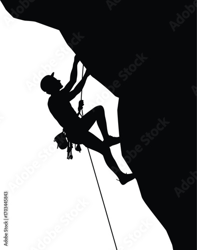 Silhouette of person climbing rock face mountain