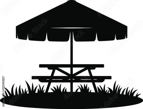 Picnic table under umbrella on grass outdoor seating