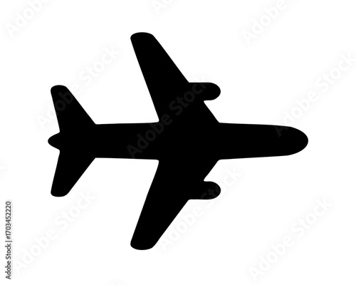 A simple black airplane flying in the sky on a clear day