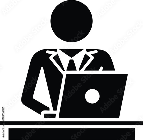 Black figure in suit works using a laptop while sitting at a desk