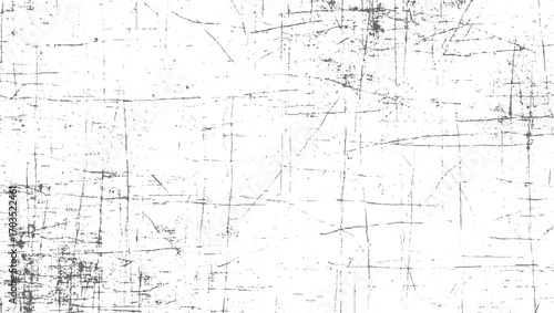 White surface with dark grey scratches and speckles lines