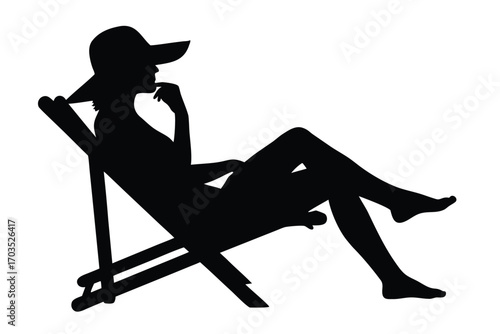 Silhouetted figure with hat sits pensively on a beach chair, finger to lips