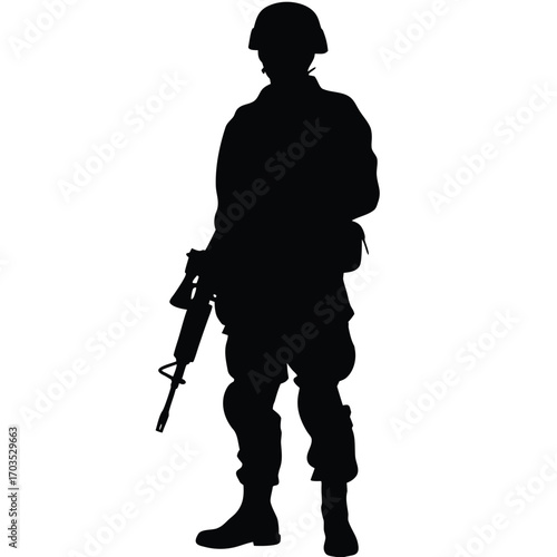 Armed soldier stands with rifle wearing helmet and combat boots in a black silhouette