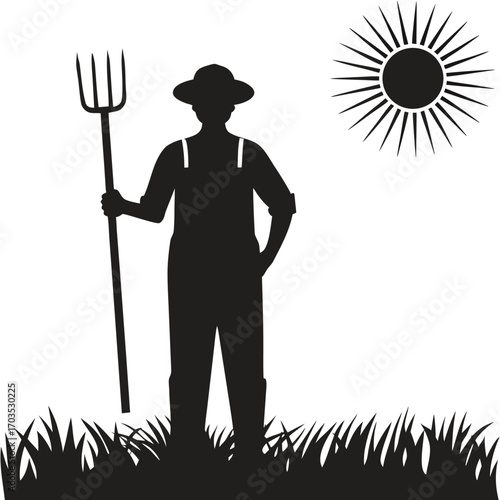 Silhouette of a farmer holding a pitchfork stands in a field under the sun