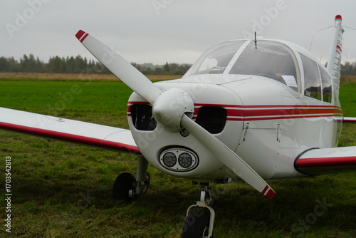 Piper Cherokee 140 Light Aircraft on a Grassy Airfield