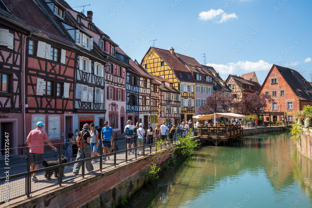 Fototapeta premium Colmar’s Charming Canals and Half-Timbered Houses in the Sun