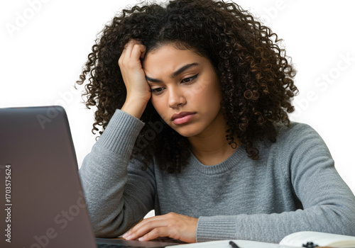 Young woman feeling stressed and overwhelmed while studying