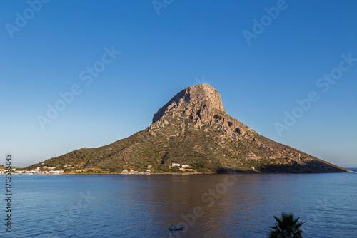 View of the rugged Telendos island in Greece on a sunny day.
