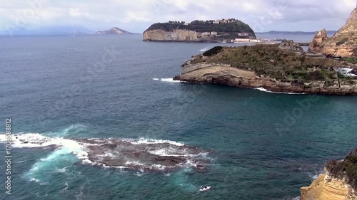 Coastline facing the island of Nisida in the Gulf of Napoli. Inlet adjacent to Trentaremi (thirty oars) Bay, next to Dente di Cane (Tooth’s dog) cliff in western district of Posillipo, Naples, Italy.