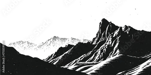 Black and white panorama of snowy mountain peaks and a cloudy winter sky