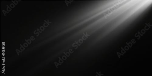 Black, brushed steel surface with a silver metallic pattern and a spotlight on stage