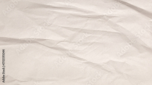 A textured beige paper surface features prominent crumples. The natural imperfections create a rustic, artistic backdrop suitable for various creative applications