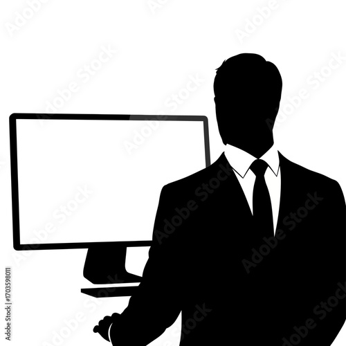 Silhouette of a businessman in a suit in front of a computer