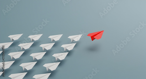 Red paper airplane leading a group of white paper airplanes, symbolizing leadership, innovation, and individuality.