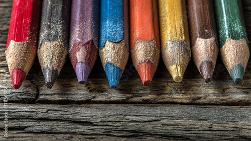Colored Pencils Arranged on Wooden Background