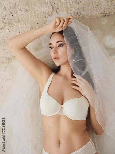 Girl model in lingerie posing in a photo studio, beautiful lingerie and loft atmosphere.