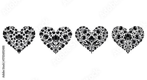 Four decorative floral heart shapes adorned with delicate botanical elements close up vector