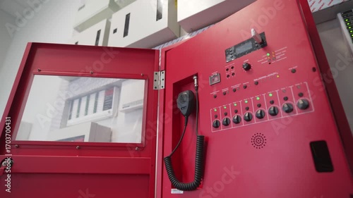 Inspection scene shows bright metal control box with open door. Fire alarm system demonstrates safety process and technical restoration