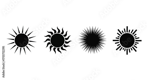 Four abstract stylized sun icons with rough textured rays in black and white vector