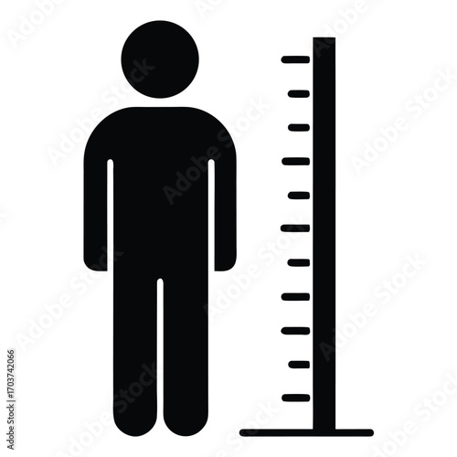 Silhouette of a Person Standing Next to Height Measurement Scale in Black and White