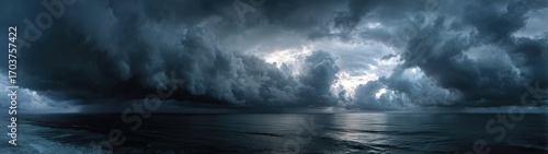 Dark storm clouds over a vast ocean