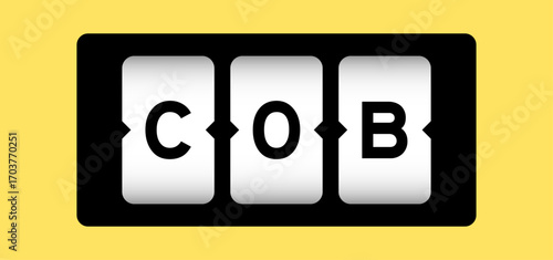 Black color in word COB (abbreviation of close of business) on slot banner with yellow color background